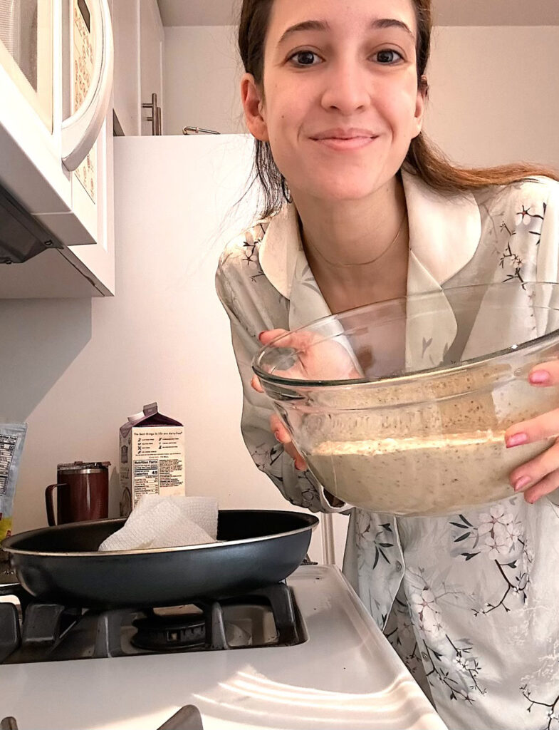 a female woman holding a bowl of batter